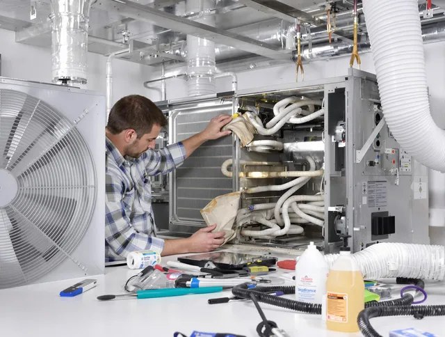 Glocester Air Duct Cleaning specialist performing precision AC coil cleaning in Glocester