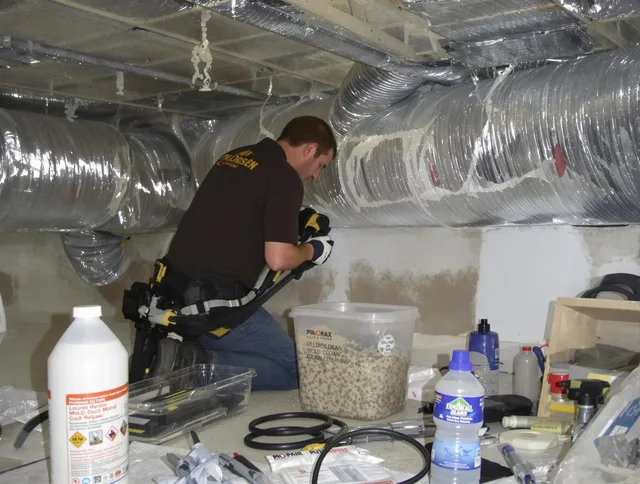 Glocester Air Duct Cleaning specialist performing professional mold removal from air ducts in Glocester