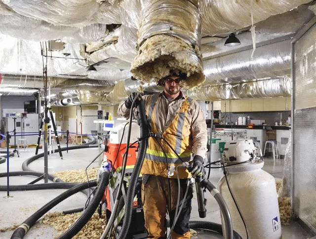 Professional vacuum insulation removal by Glocester Air Duct Cleaning expert in Glocester